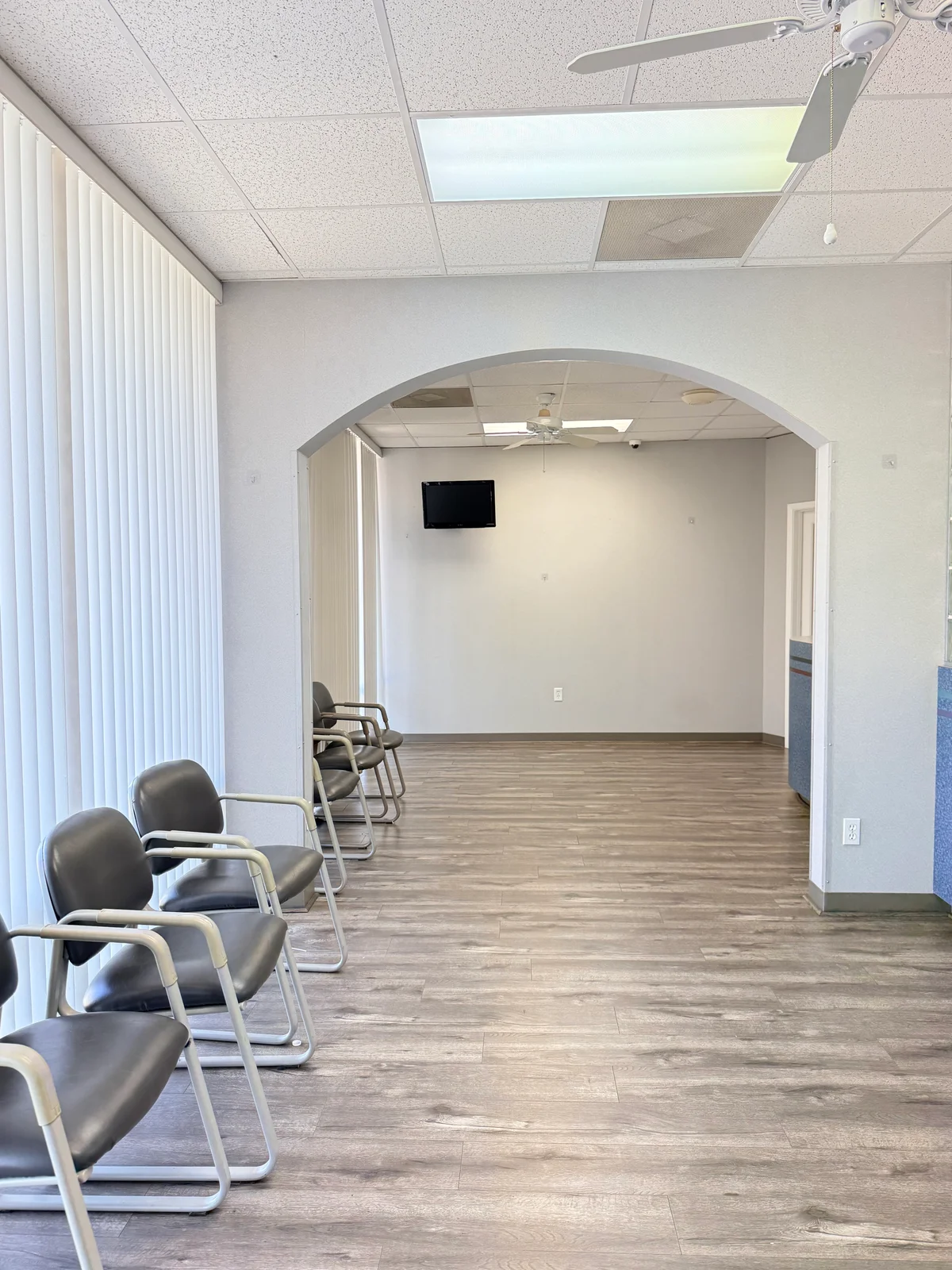 Waiting area with chairs along the windows