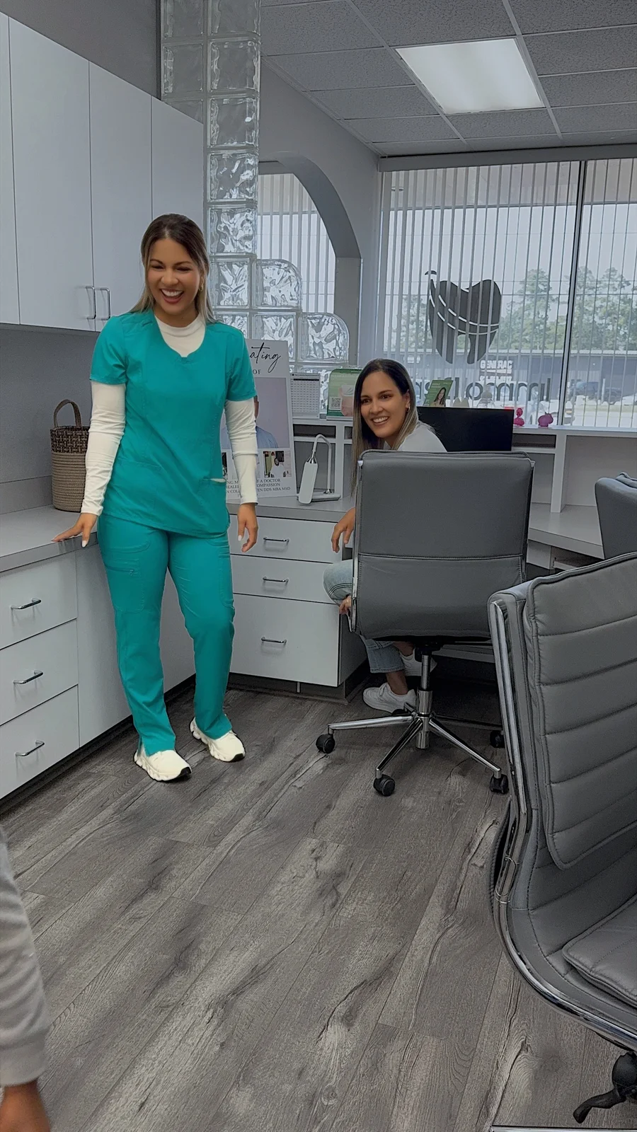 Two team members in the reception workspace